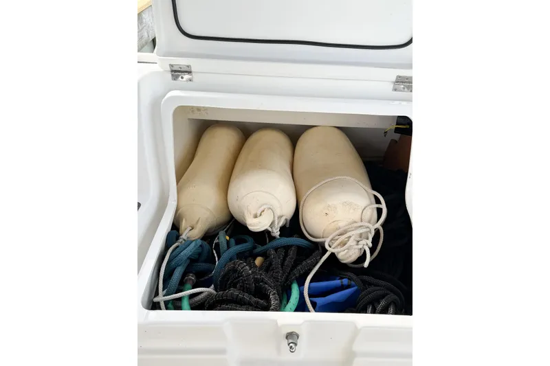 Slide: The Image of Storage compartment on 2013 Jeanneau Sun Odyssey 409 with fenders and ropes. - 20