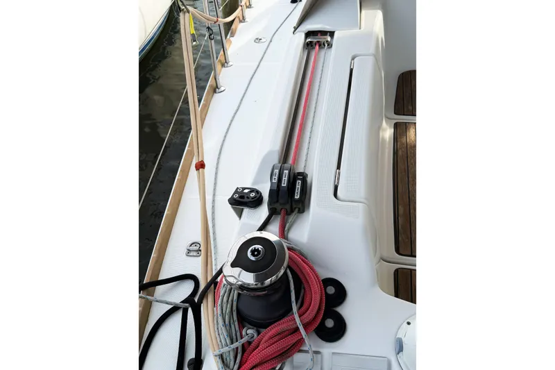 Slide: The Image of Jeanneau Sun Odyssey 409 sailboat deck with winch and ropes, 2013 model. - 21