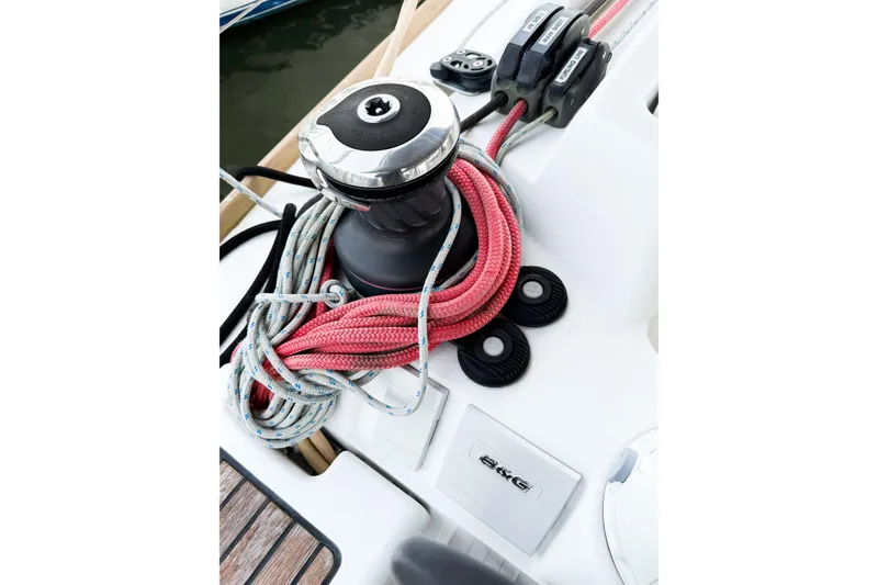Slide: The Image of Jeanneau Sun Odyssey 409 sailboat winch with red and blue ropes, 2013 model. - 27