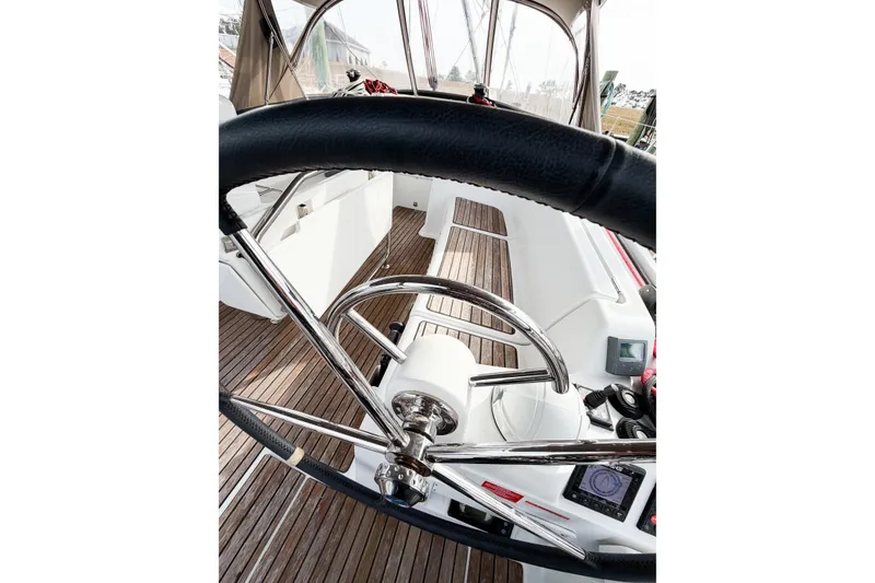 Slide: The Image of Steering wheel of 2013 Jeanneau Sun Odyssey 409 sailboat with wooden deck. - 31