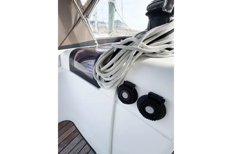 Slide: The Image of Jeanneau Sun Odyssey 409, 2013 model, featuring deck details with ropes and winches. - 34