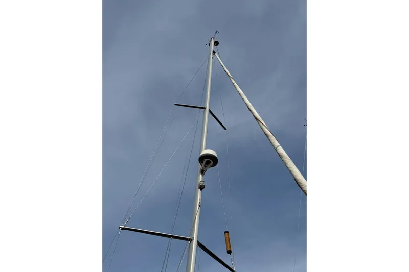 Slide: The Image of Mast of 2013 Jeanneau Sun Odyssey 409 sailboat against a clear sky. - 4