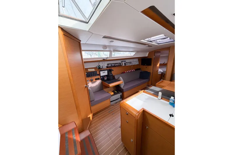 Slide: The Image of Interior of 2013 Jeanneau Sun Odyssey 409 sailboat, featuring cozy seating and modern amenities. - 41