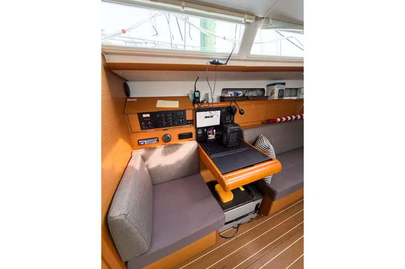 Slide: The Image of Interior of 2013 Jeanneau Sun Odyssey 409 sailboat with navigation equipment and seating area. - 46