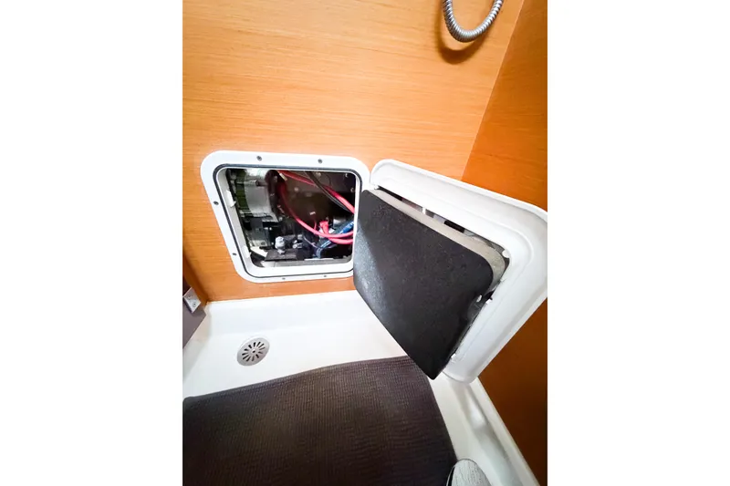 Slide: The Image of Access panel in Jeanneau Sun Odyssey 409, 2013 model, showing internal wiring and components. - 58