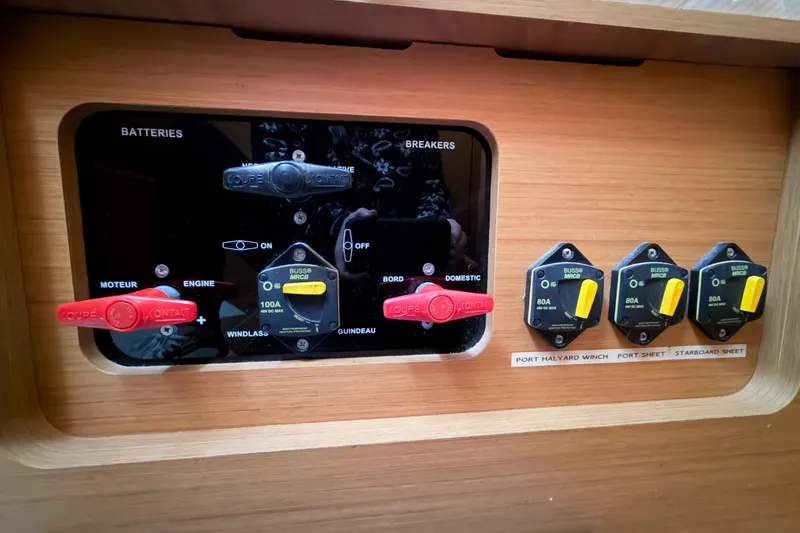 Slide: The Image of Electrical panel of 2013 Jeanneau Sun Odyssey 409 sailboat with labeled switches and breakers. - 60