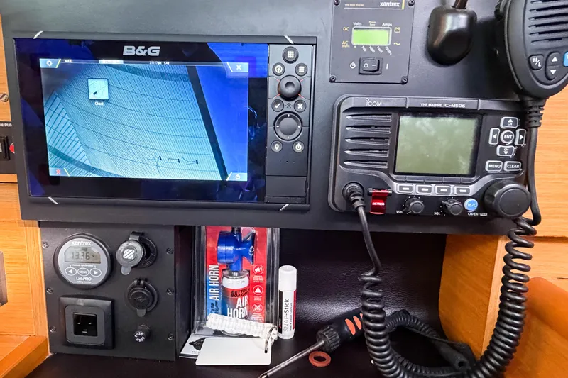 Slide: The Image of Control panel of 2013 Jeanneau Sun Odyssey 409 with navigation and communication equipment. - 67