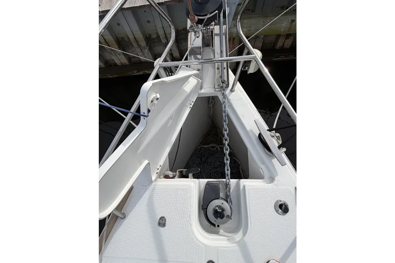 Slide: The Image of Anchor chain locker on 2013 Jeanneau Sun Odyssey 409 sailboat, showing deck and fittings. - 9