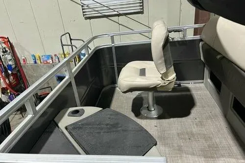 Slide: The Image of 2024 Sun Tracker Fishin' Barge 20 DLX interior with seating and fishing platform. - 10