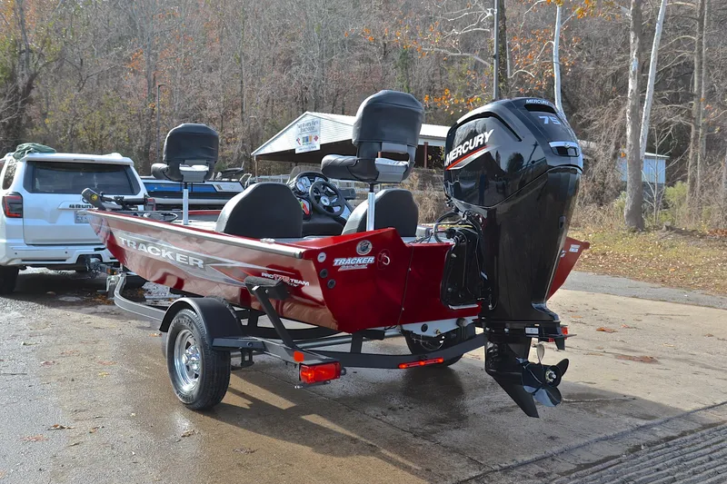 Slide: The Image of 2023 Tracker Pro Team 175 TXW boat with Mercury engine on trailer. - 12