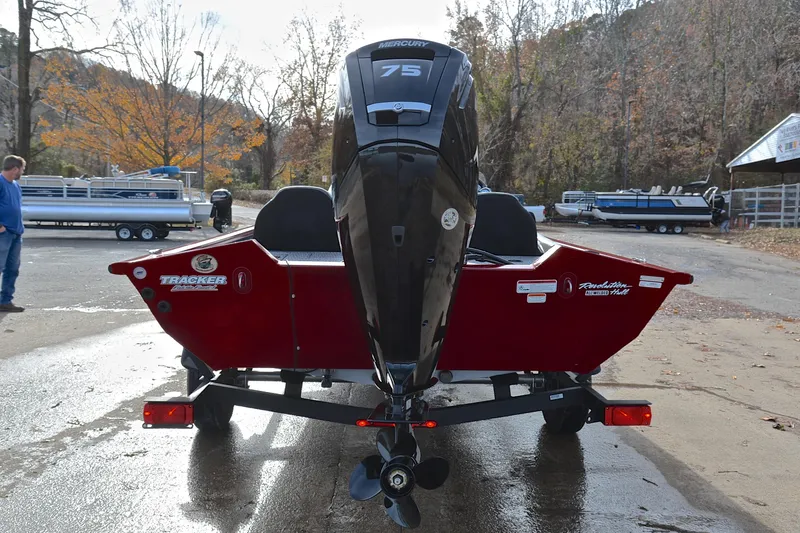 Slide: The Image of 2023 Tracker Pro Team 175 TXW boat with Mercury 75 engine, parked outdoors. - 13