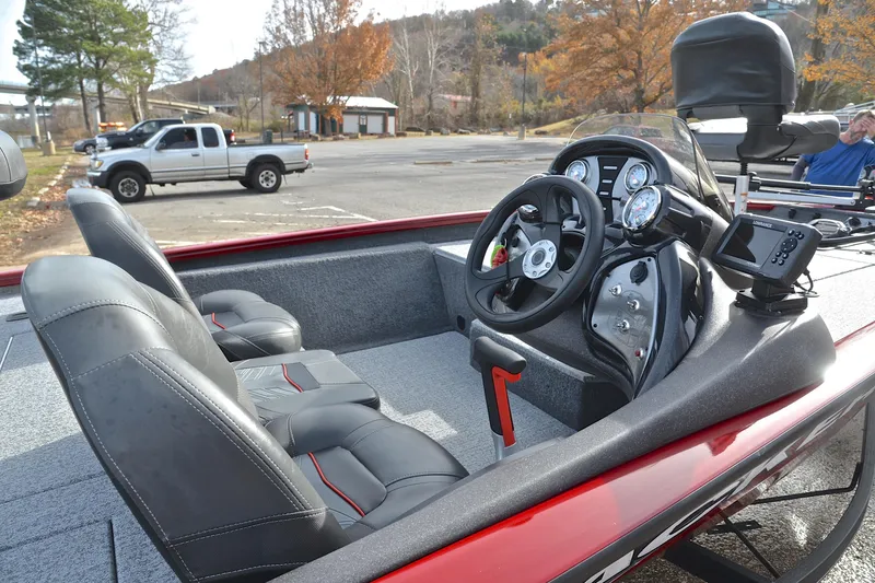 Slide: The Image of 2023 Tracker Pro Team 175 TXW boat interior with steering wheel and seats. - 19
