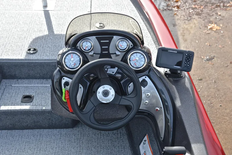 Slide: The Image of 2023 Tracker Pro Team 175 TXW boat dashboard with steering wheel and gauges. - 24