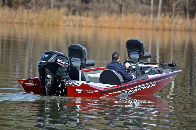 Slide: The Image of 2023 Tracker Pro Team 175 TXW boat on calm water, featuring Mercury engine. - 8