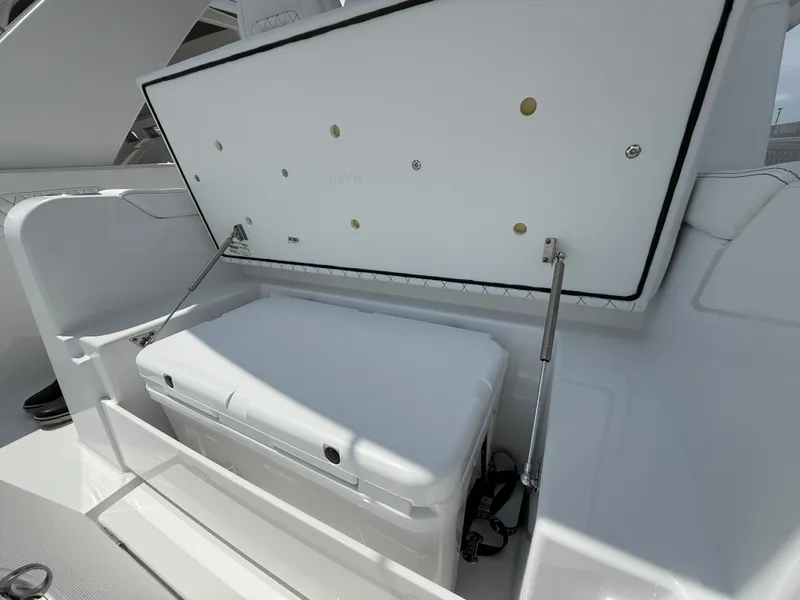Slide: The Image of Intrepid 35 PANACEA 2026 boat with open storage compartment lid. - 16