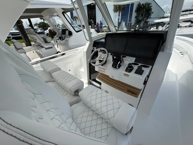 Slide: The Image of Interior of 2026 Intrepid 35 PANACEA with luxurious white seating. - 17