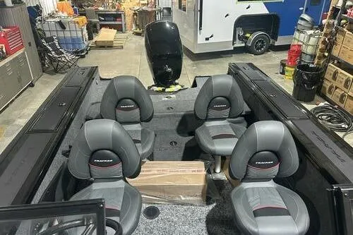 Slide: The Image of 2026 Tracker Targa V-18 Combo boat interior with four seats in a workshop setting. - 10