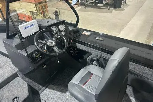 Slide: The Image of 2026 Tracker Targa V-18 Combo boat interior with steering wheel and dashboard. - 6