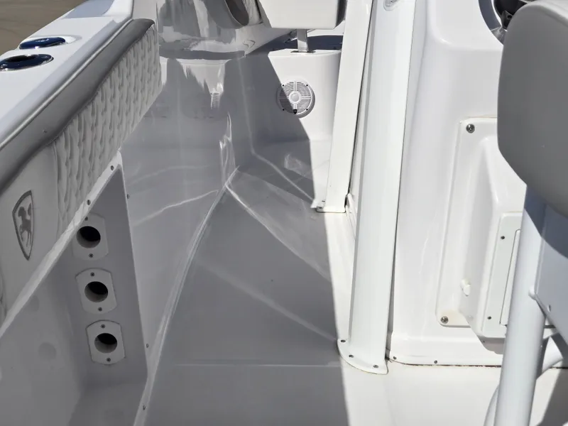 Slide: The Image of Interior of 2024 Century 2600 boat, white upholstery and speaker. - 6