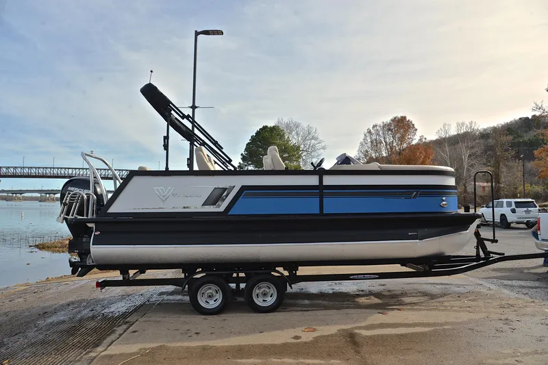 Slide: The Image of 2022 Viaggio Diamante Q pontoon boat on trailer by a lakeside ramp. - 17