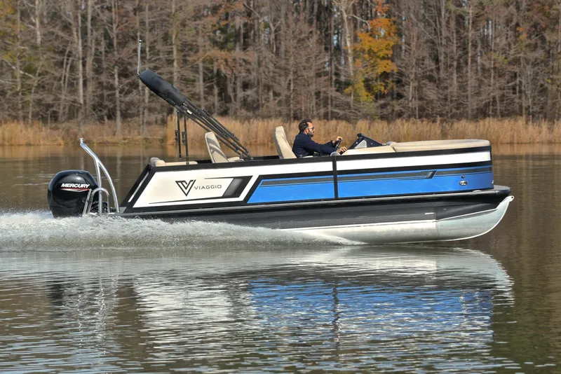 Slide: The Image of 2022 Viaggio Diamante Q pontoon boat cruising on a calm lake. - 3