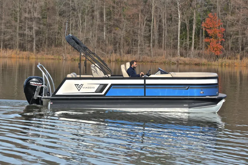 Slide: The Image of 2022 Viaggio Diamante Q pontoon boat cruising on a calm lake. - 8