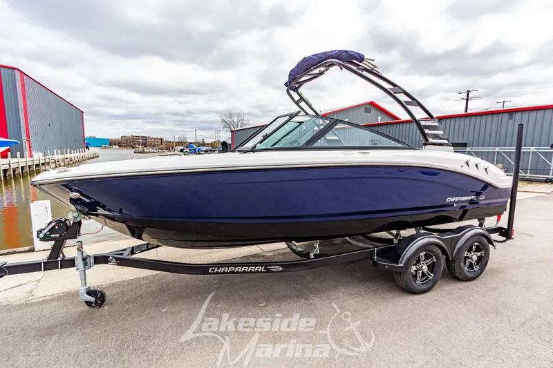 The Image of 2025 Chaparral 21 SSi boat on trailer at Lakeside Marina, overcast day. - 1
