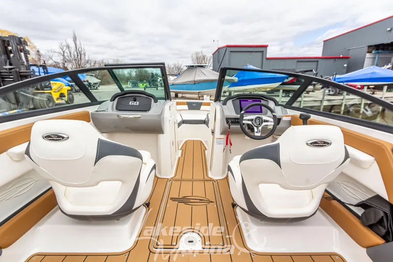 Slide: The Image of Interior view of 2025 Chaparral 21 SSi boat with modern dashboard and seating. - 20