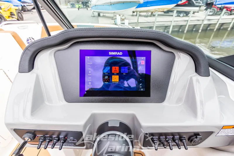 Slide: The Image of Dashboard of 2025 Chaparral 21 SSi boat with Simrad display and controls. - 23
