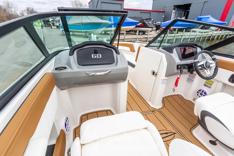Slide: The Image of 2025 Chaparral 21 SSi boat interior with modern dashboard and seating. - 24
