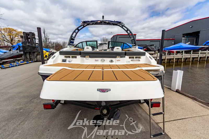 Slide: The Image of 2025 Chaparral 21 SSi boat at Lakeside Marina, featuring a spacious swim platform. - 5