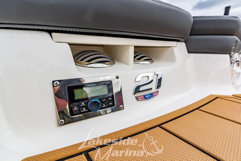 Slide: The Image of 2025 Chaparral 21 SSi boat interior with audio system and branding details. - 9