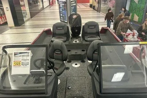 Slide: The Image of 2025 Tracker Pro Guide V-175 Combo boat displayed in a shopping mall setting. - 8