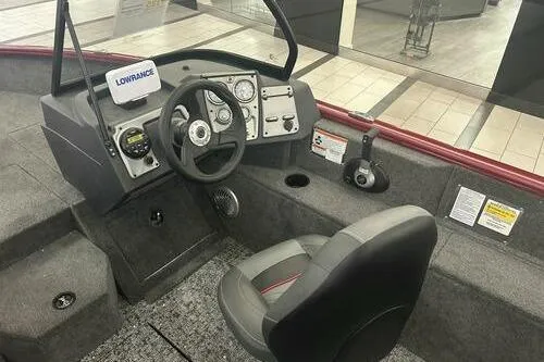 Slide: The Image of 2025 Tracker Pro Guide V-175 Combo boat interior with steering console and seating. - 9
