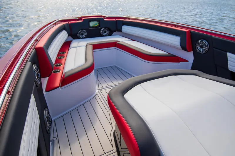 Slide: The Image of 2025 Cigarette 41 Nighthawk boat interior with red and white seating, on water. - 10