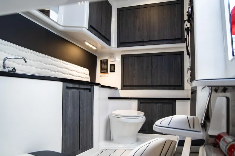 Slide: The Image of Interior of 2025 Cigarette 41 Nighthawk boat, featuring modern cabinetry and sleek design. - 12