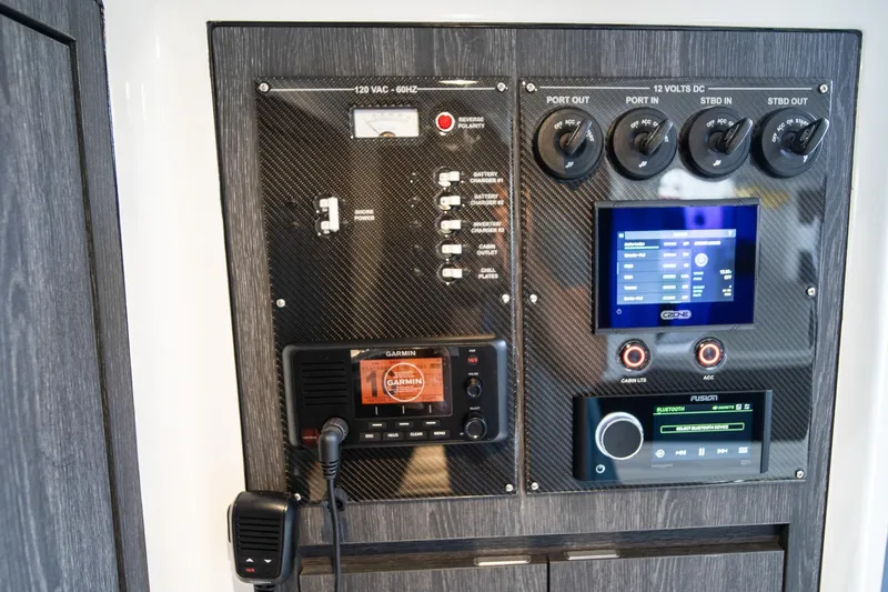 Slide: The Image of Control panel of 2025 Cigarette 41 Nighthawk boat with Garmin and Fusion systems. - 14