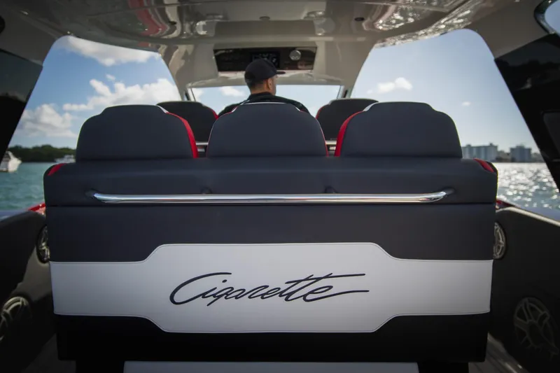 Slide: The Image of 2025 Cigarette 41 Nighthawk luxury boat interior with stylish seating and scenic water view. - 22