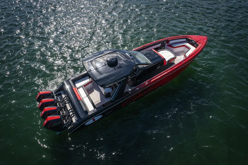 Slide: The Image of 2025 Cigarette 41 Nighthawk boat on water, featuring sleek design and powerful engines. - 38