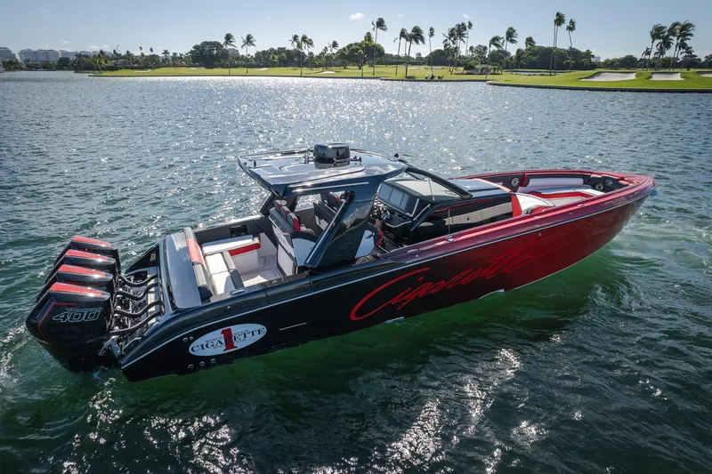 Slide: The Image of 2025 Cigarette 41 Nighthawk boat on water, featuring sleek design and powerful engines. - 39