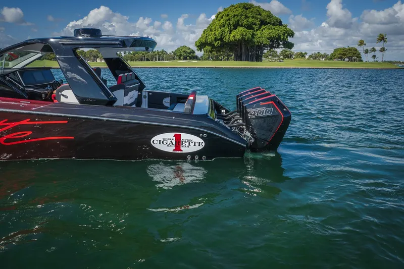 Slide: The Image of 2025 Cigarette 41 Nighthawk boat on water, featuring powerful engines and sleek design. - 40