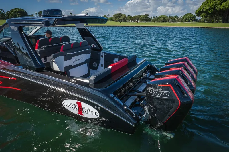 Slide: The Image of 2025 Cigarette 41 Nighthawk boat with powerful engines on a serene lake. - 41