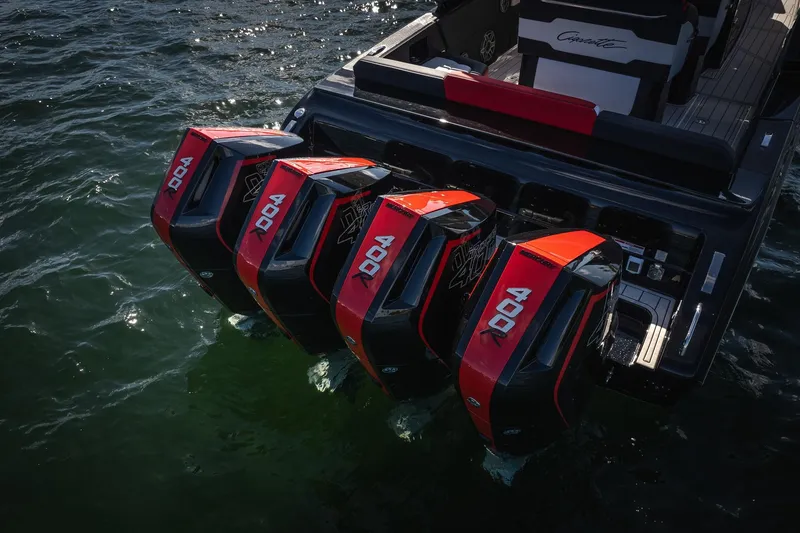 Slide: The Image of 2025 Cigarette 41 Nighthawk with four powerful outboard engines on water. - 44