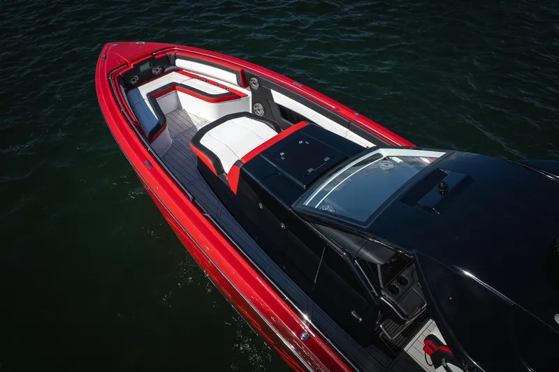 Slide: The Image of 2025 Cigarette 41 Nighthawk boat with sleek red and black design on water. - 47