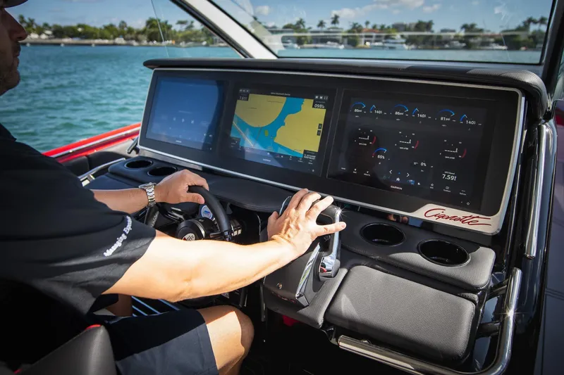 Slide: The Image of Cockpit of 2025 Cigarette 41 Nighthawk with advanced navigation displays. - 5