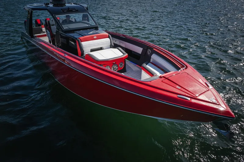 Slide: The Image of 2025 Cigarette 41 Nighthawk boat in vibrant red on open water. - 50