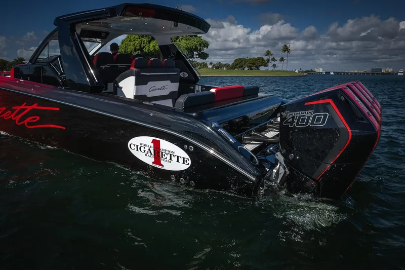 Slide: The Image of 2025 Cigarette 41 Nighthawk boat with Racing 400 engine on water. - 56