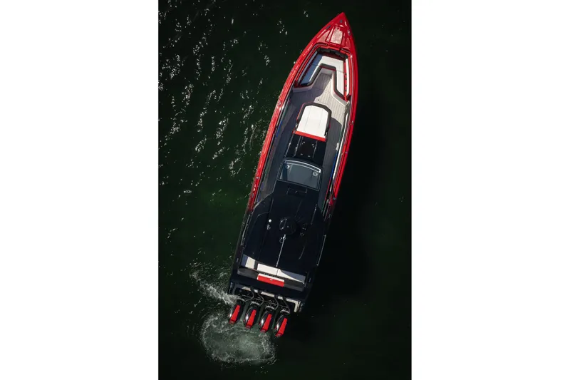 Slide: The Image of 2025 Cigarette 41 Nighthawk boat, aerial view, sleek design, vibrant red and black colors. - 58