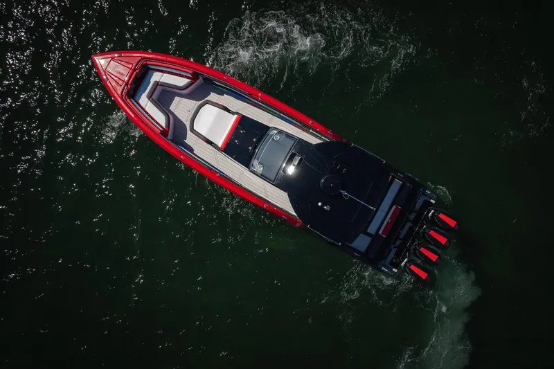 Slide: The Image of Aerial view of 2025 Cigarette 41 Nighthawk boat cruising on water. - 60