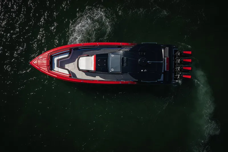 Slide: The Image of Aerial view of 2025 Cigarette 41 Nighthawk boat on water, showcasing sleek design. - 61